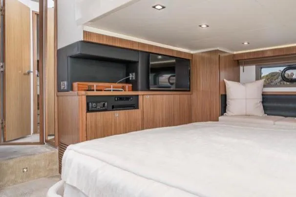 Slide: The Image of Luxurious interior of 2017 Sea Ray 460 Sundancer yacht with modern wood finishes. - 19