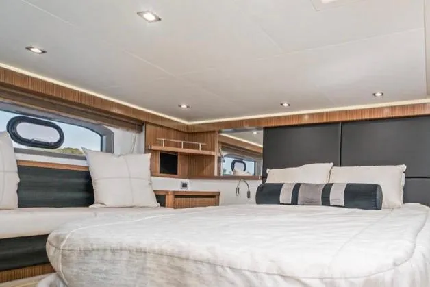 Slide: The Image of Luxurious interior of 2017 Sea Ray 460 Sundancer yacht bedroom. - 21