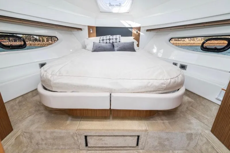 Slide: The Image of Luxurious cabin interior of 2017 Sea Ray 460 Sundancer yacht with cozy bed. - 24