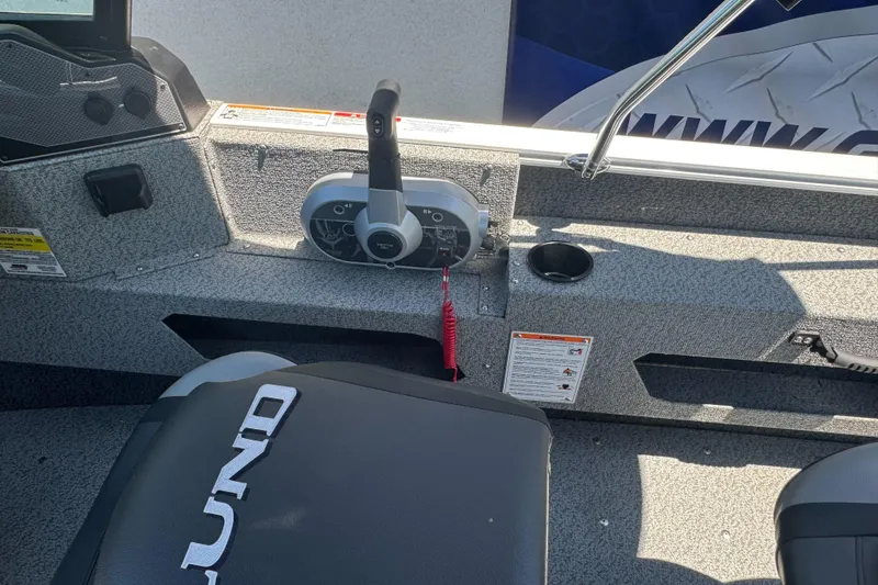Slide: The Image of Interior of 2026 Lund 1775 Adventure Sport boat showing control panel and seating. - 18