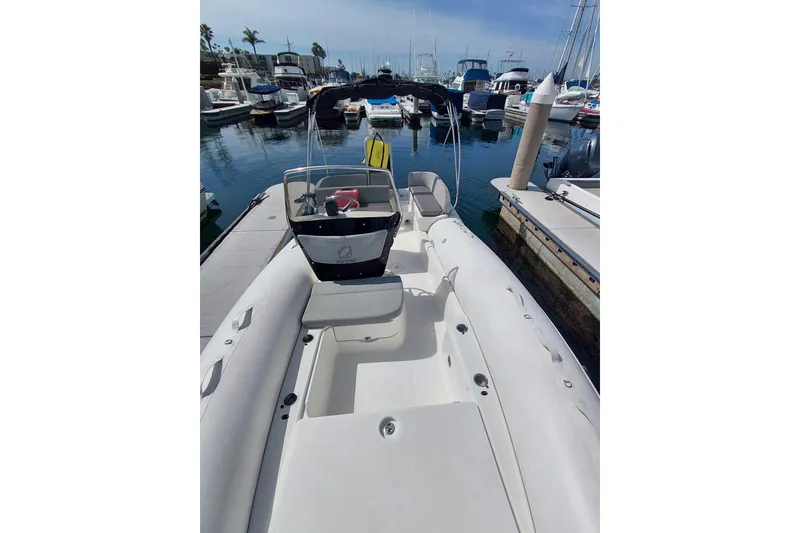 Slide: The Image of 2021 Zodiac N-ZO 680 boat docked at marina with other vessels. - 5