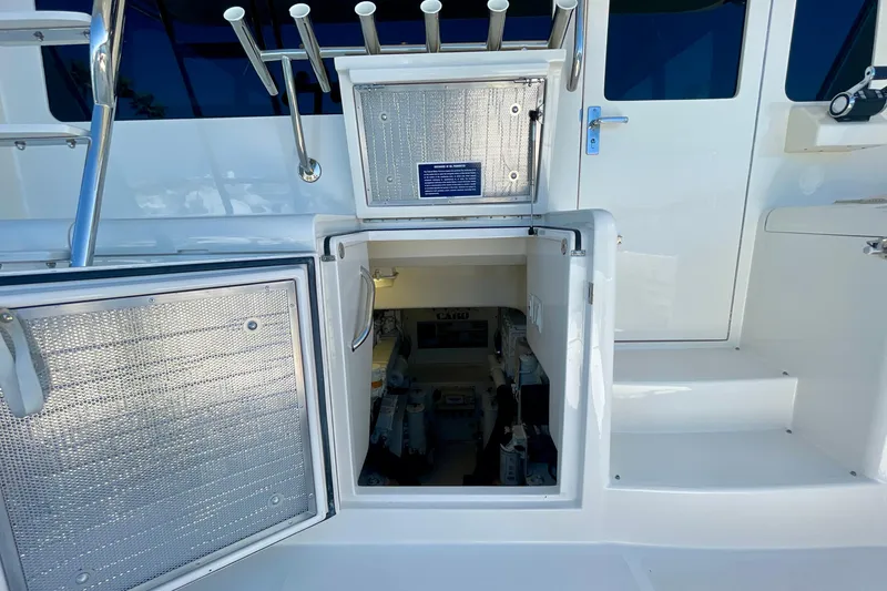 Slide: The Image of Engine compartment access on a 2006 Cabo 40 Flybridge yacht. - 100