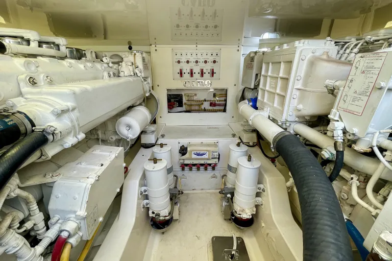 Slide: The Image of Engine room of a 2006 Cabo 40 Flybridge yacht, showcasing mechanical components and systems. - 101