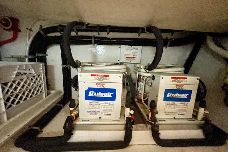 Slide: The Image of Cruisair units in 2006 Cabo 40 Flybridge engine room, showcasing marine air conditioning systems. - 107