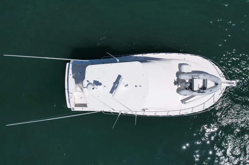 Slide: The Image of Aerial view of 2006 Cabo 40 Flybridge yacht on calm water. - 11
