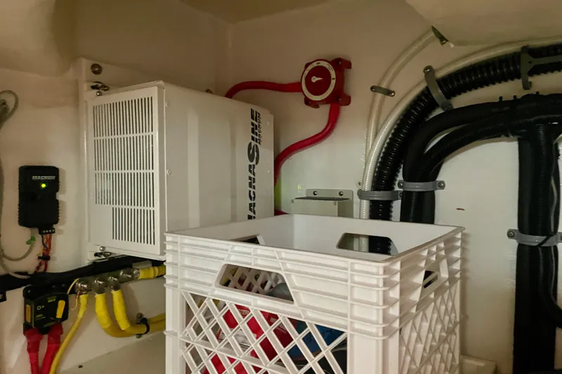 Slide: The Image of Electrical system inside a 2006 Cabo 40 Flybridge boat, featuring wiring and components. - 110