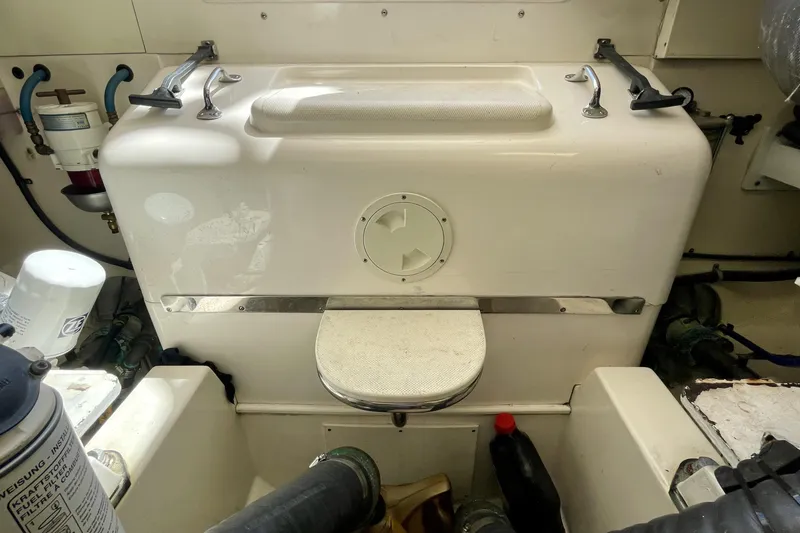 Slide: The Image of Engine compartment of a 2006 Cabo 40 Flybridge boat, showcasing mechanical components. - 111