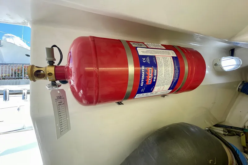 Slide: The Image of Fire suppression system on a 2006 Cabo 40 Flybridge boat interior. - 113