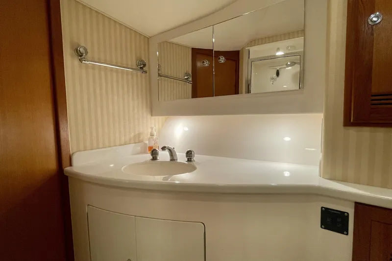 Slide: The Image of Luxurious bathroom interior of 2006 Cabo 40 Flybridge yacht with elegant fixtures. - 15