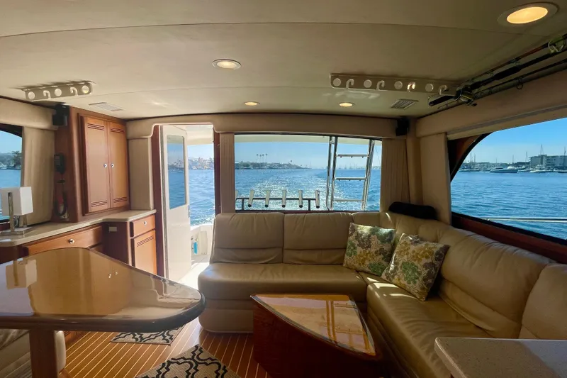 Slide: The Image of Luxurious interior of 2006 Cabo 40 Flybridge yacht with ocean view through large windows. - 34