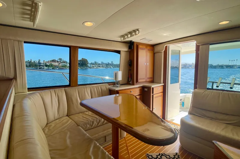 Slide: The Image of Luxurious interior of 2006 Cabo 40 Flybridge yacht with waterfront view. - 35
