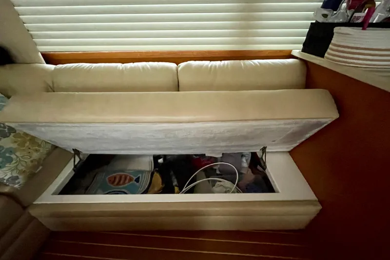 Slide: The Image of Storage compartment under seat in 2006 Cabo 40 Flybridge yacht interior. - 41