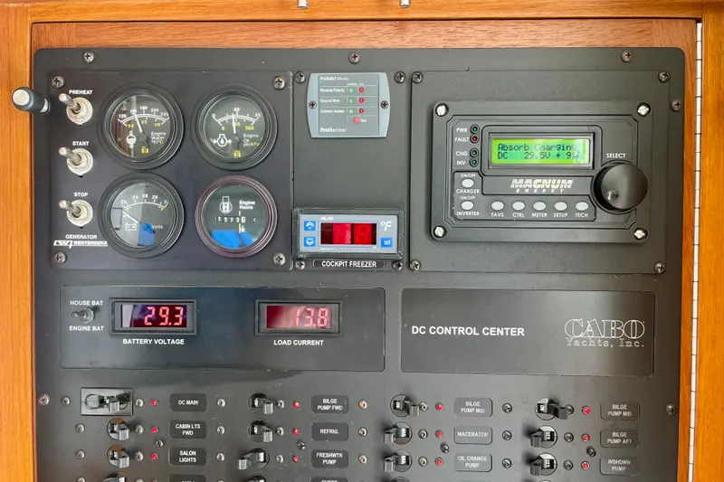 Slide: The Image of Control panel of a 2006 Cabo 40 Flybridge yacht, displaying gauges and switches. - 46