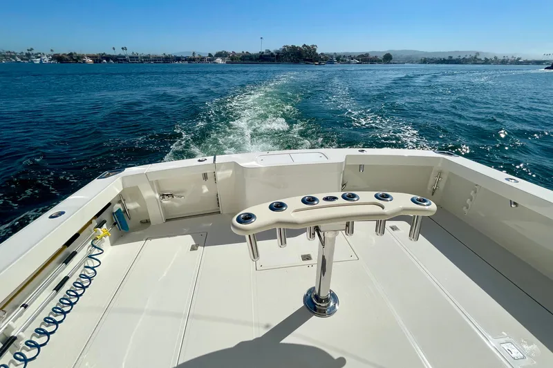 Slide: The Image of Cabo 40 Flybridge 2006 yacht cruising on a sunny day, showcasing spacious deck and ocean view. - 51