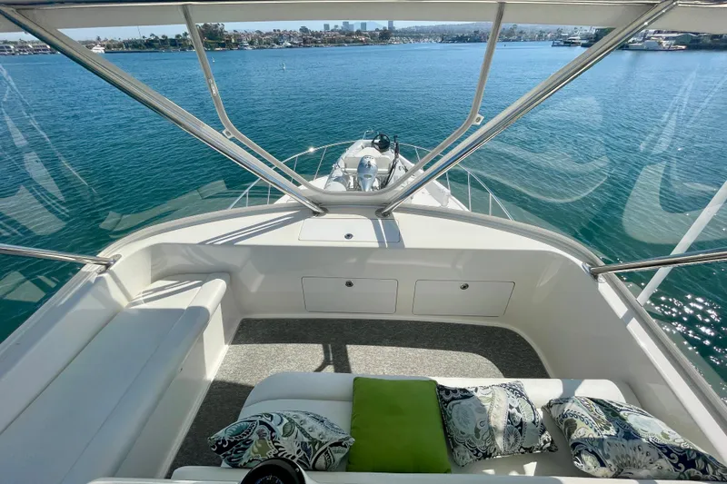 Slide: The Image of Flybridge view from 2006 Cabo 40, overlooking serene blue waters and distant shoreline. - 55