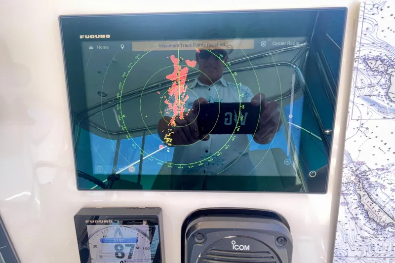 Slide: The Image of Radar display on a 2006 Cabo 40 Flybridge boat with navigation equipment. - 68