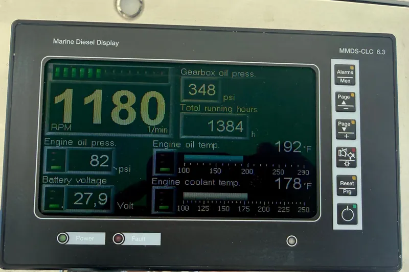 Slide: The Image of Marine diesel display showing RPM, oil pressure, temperature, and voltage for 2006 Cabo 40 Flybridge. - 71