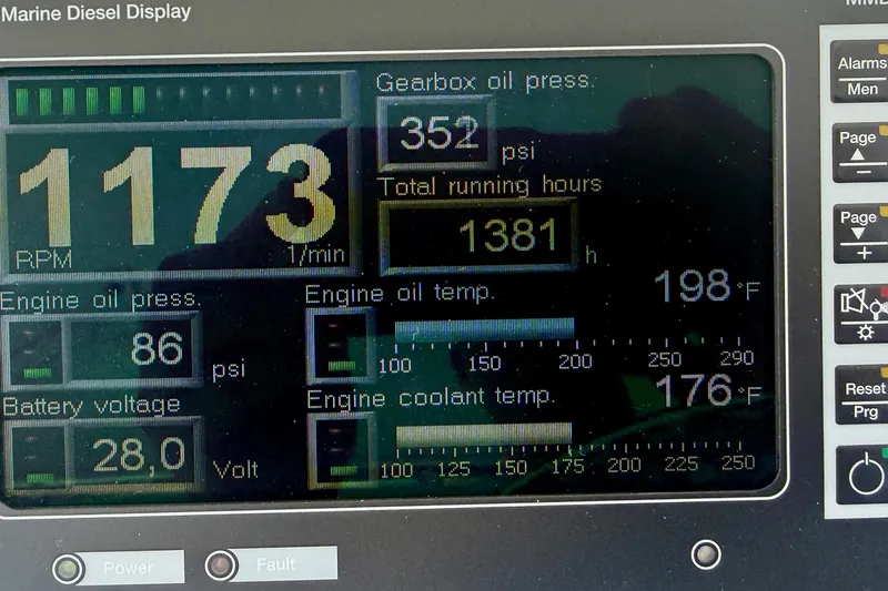 Slide: The Image of Marine diesel display showing RPM, oil pressure, temperature, and voltage for 2006 Cabo 40 Flybridge. - 72