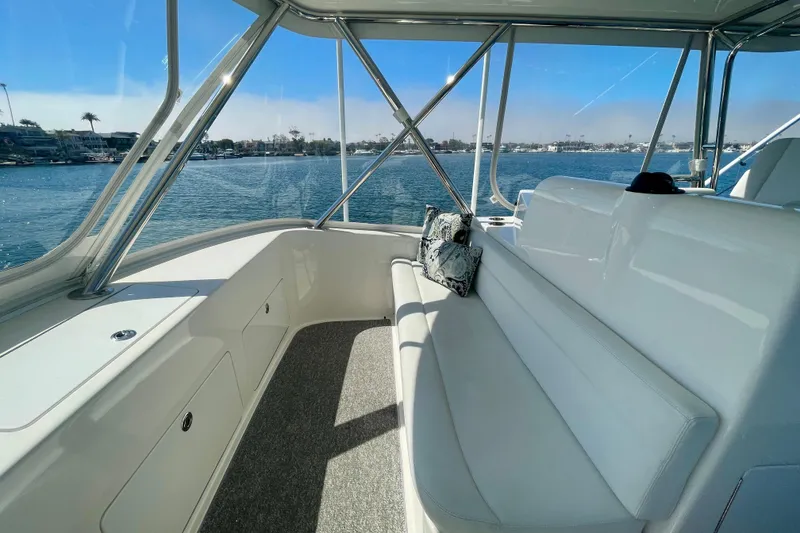 Slide: The Image of Luxurious interior of 2006 Cabo 40 Flybridge yacht with waterfront view. - 74