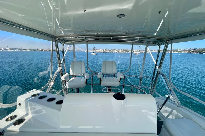 Slide: The Image of Flybridge view of 2006 Cabo 40 yacht overlooking serene blue waters. - 75