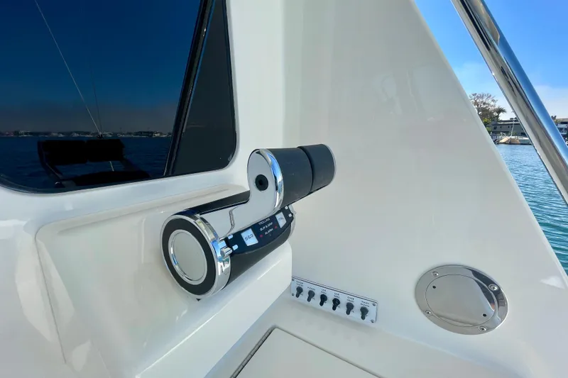 Slide: The Image of Control panel on a 2006 Cabo 40 Flybridge yacht, overlooking serene waters. - 77