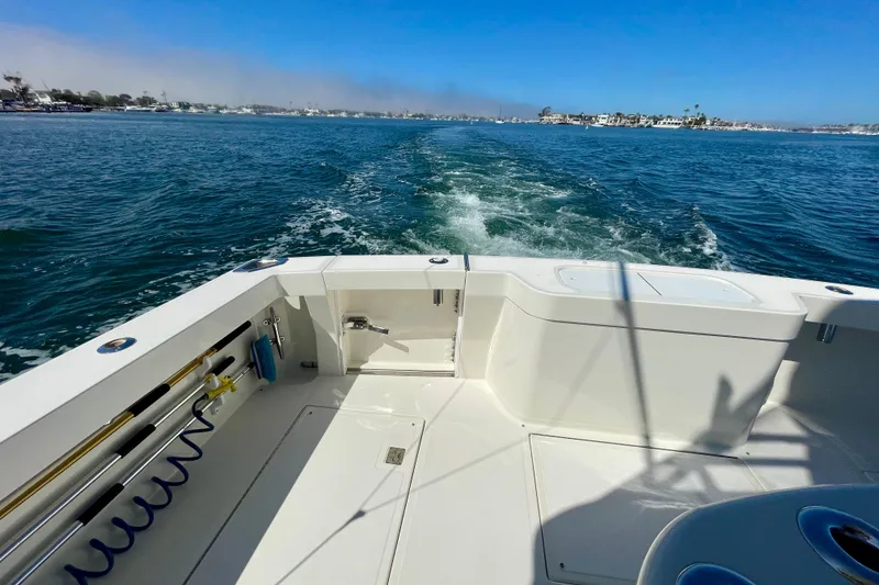 Slide: The Image of 2006 Cabo 40 Flybridge boat cruising on open water, leaving a wake behind. - 81
