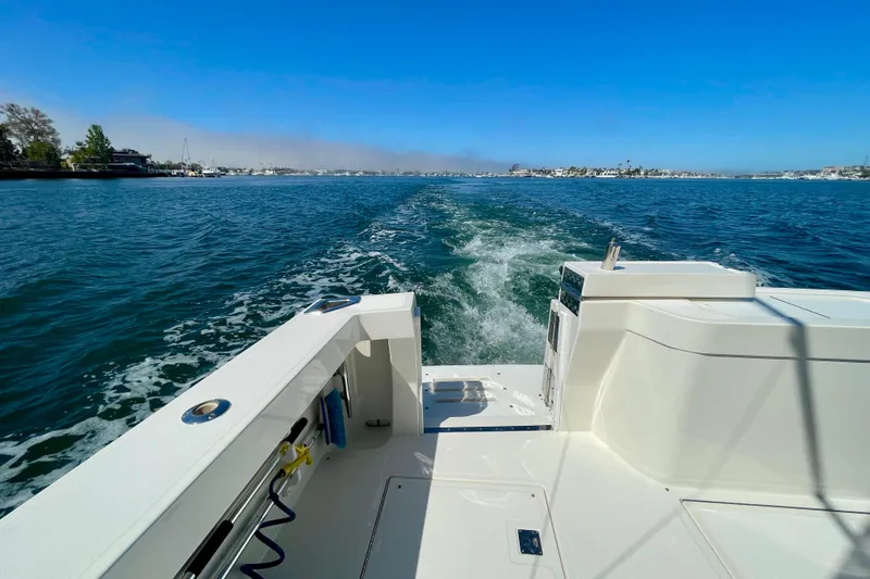 Slide: The Image of 2006 Cabo 40 Flybridge cruising on open water under clear blue skies. - 82