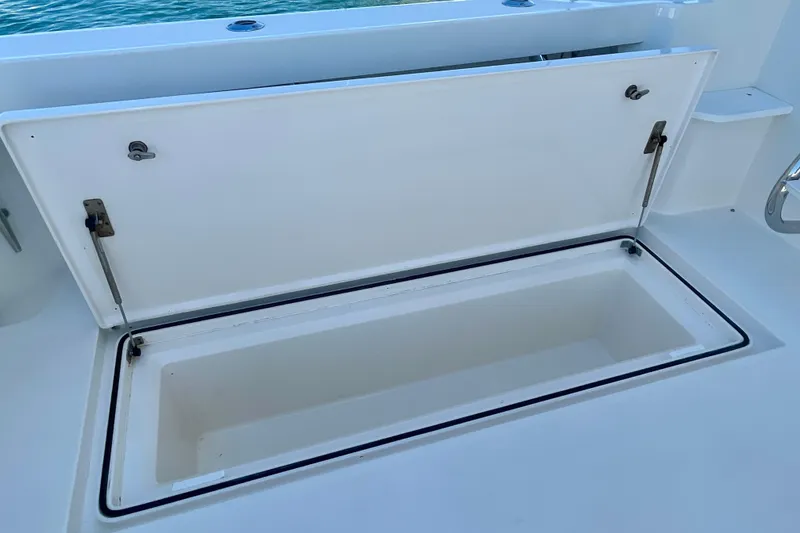 Slide: The Image of Open storage compartment on a 2006 Cabo 40 Flybridge boat deck. - 97