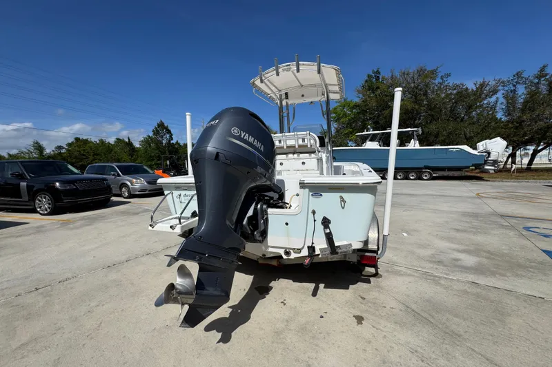 Slide: The Image of 2015 Sportsman Masters 227 Bay Boat with Yamaha outboard motor in parking lot. - 14