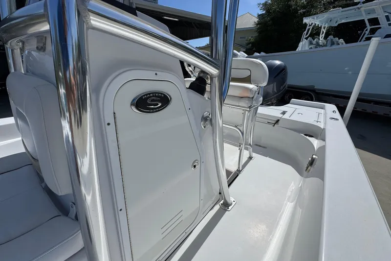 Slide: The Image of 2015 Sportsman Masters 227 Bay Boat interior with sleek design and chrome accents. - 26