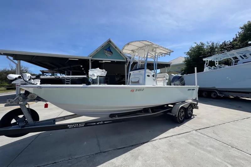 Slide: The Image of 2015 Sportsman Masters 227 Bay Boat on trailer, parked outdoors under clear sky. - 3