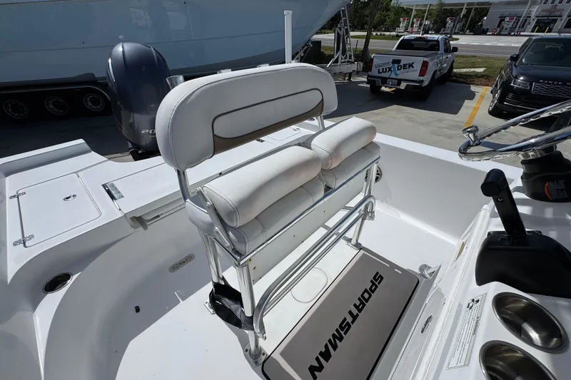 Slide: The Image of 2015 Sportsman Masters 227 Bay Boat interior with seating and steering wheel. - 31