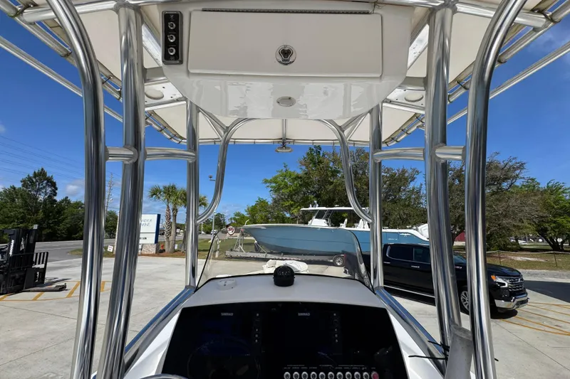 Slide: The Image of 2015 Sportsman Masters 227 Bay Boat interior view with T-top and console. - 35