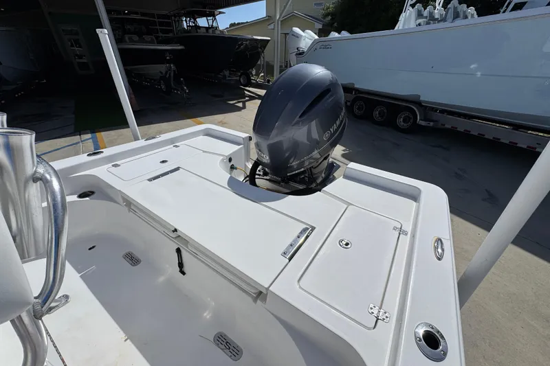 Slide: The Image of 2015 Sportsman Masters 227 Bay Boat with Yamaha outboard motor in a marina setting. - 38