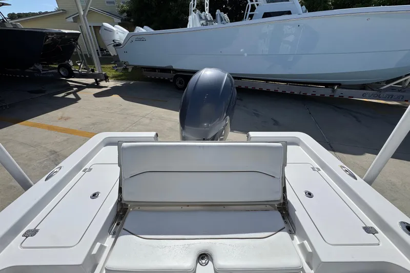 Slide: The Image of 2015 Sportsman Masters 227 Bay Boat with outboard motor in a marina setting. - 39