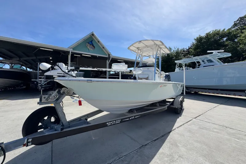 Slide: The Image of 2015 Sportsman Masters 227 Bay Boat on trailer at marina. - 4