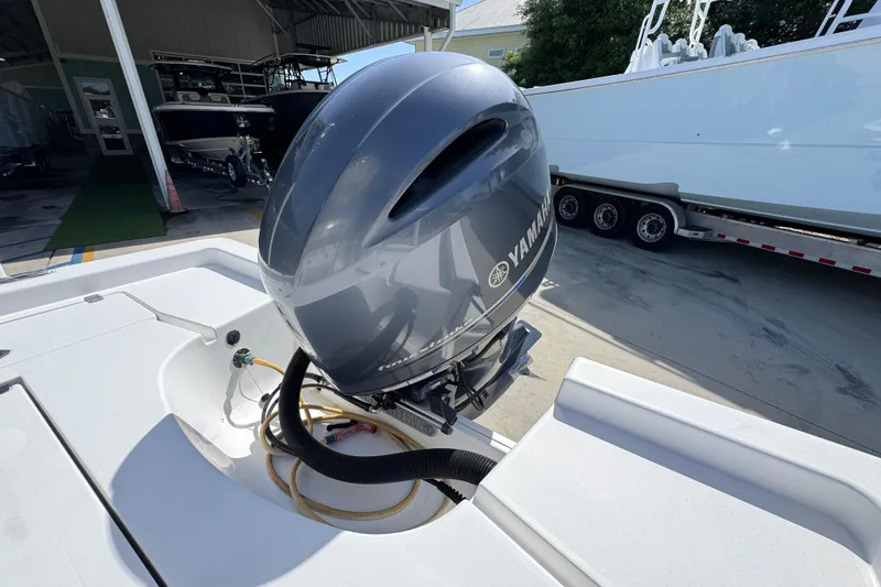 Slide: The Image of 2015 Sportsman Masters 227 Bay Boat with Yamaha outboard motor in a marina setting. - 41