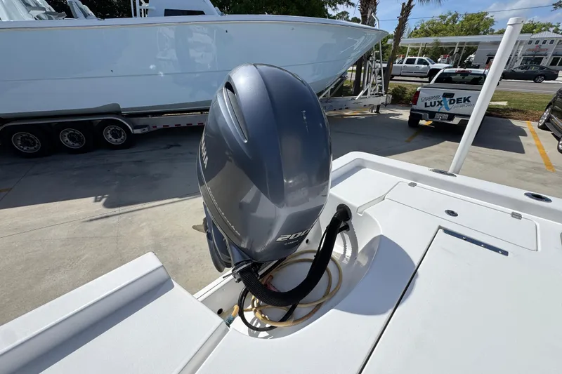 Slide: The Image of 2015 Sportsman Masters 227 Bay Boat with Yamaha outboard motor in a parking lot. - 42