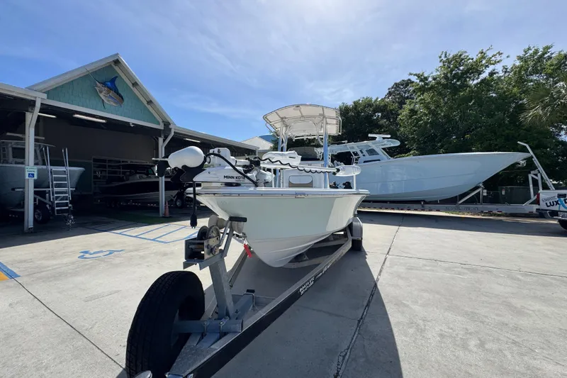 Slide: The Image of 2015 Sportsman Masters 227 Bay Boat on trailer at marina. - 5