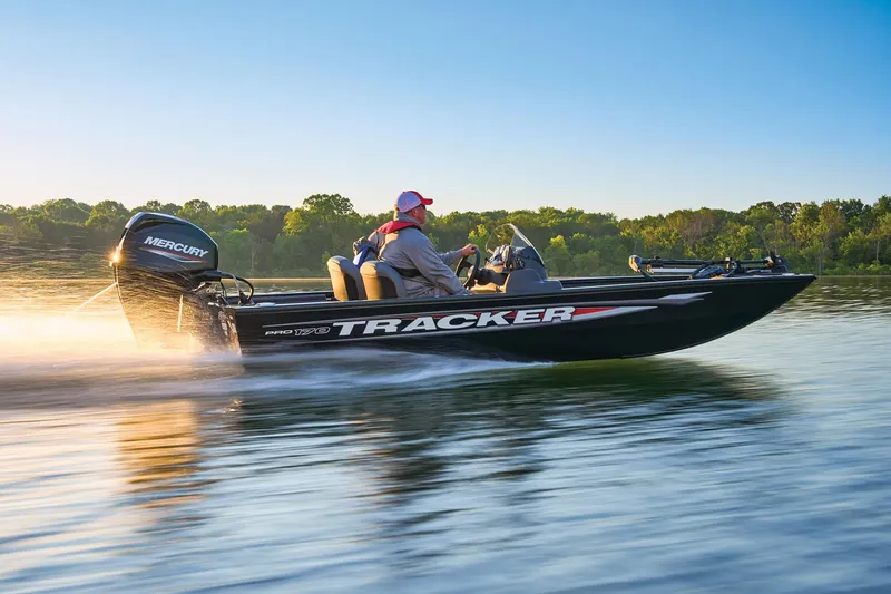 Slide: The Image of 2025 Tracker Pro 170 boat on a lake at sunset. - 36