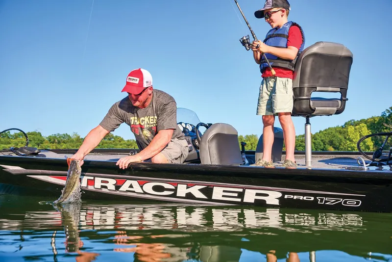 Slide: The Image of Anglers on Tracker Pro 170 boat, 2025 model, fishing scene. - 39