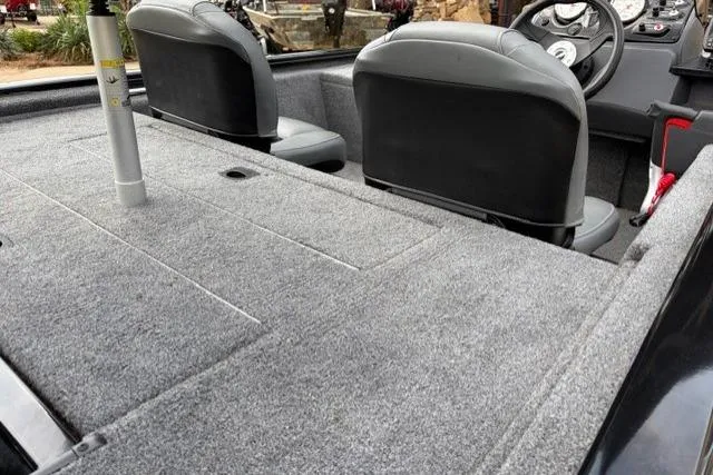 Slide: The Image of 2025 Tracker Pro 170 boat interior with gray carpet and dual seats. - 4