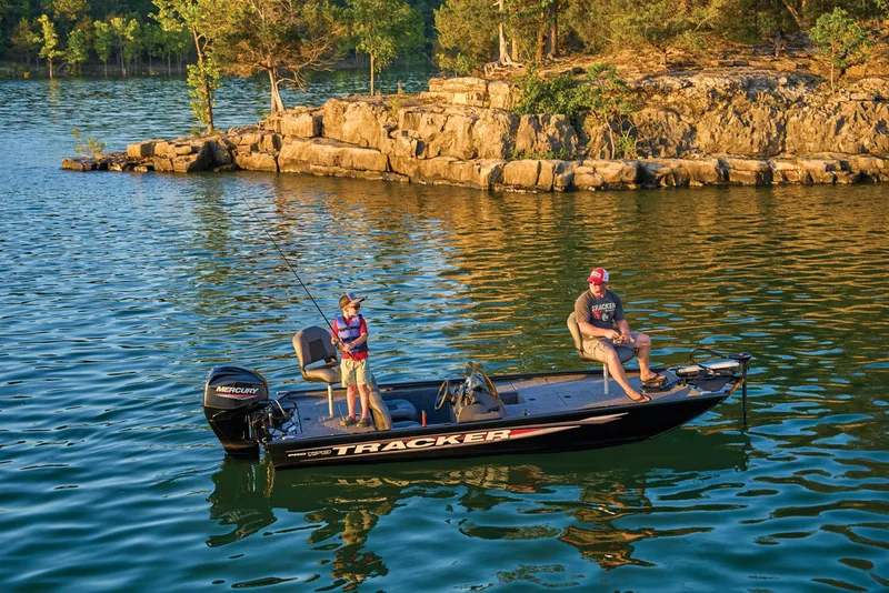 Slide: The Image of Two people fishing on a 2025 Tracker Pro 170 boat. - 43