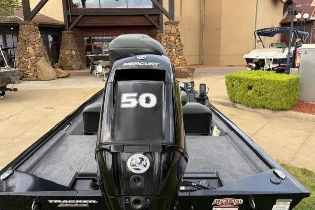 Slide: The Image of 2025 Tracker Pro 170 boat with Mercury 50 engine, displayed outdoors. - 6