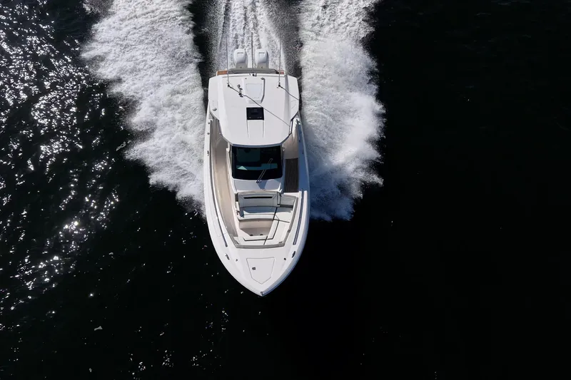 Slide: The Image of Aerial view of 2023 Tiara Sport 34 LS boat cruising on water. - 14