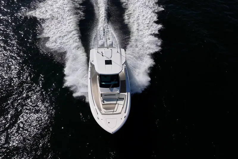 Slide: The Image of Aerial view of 2023 Tiara Sport 34 LS boat cruising on open water. - 15