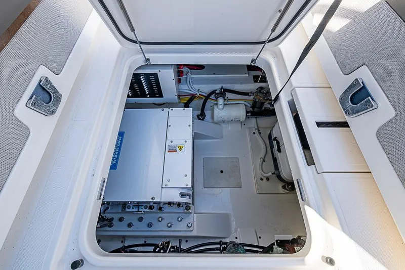 Slide: The Image of 2023 Tiara Sport 34 LS engine compartment showcasing advanced marine technology. - 24