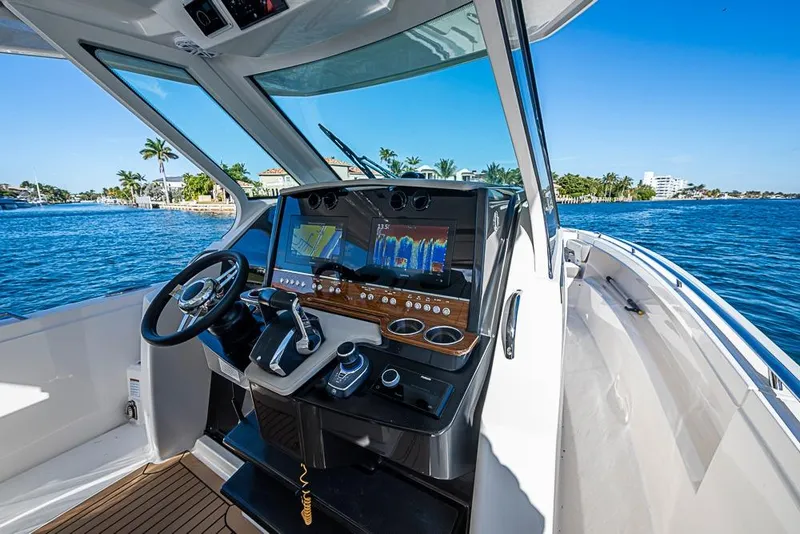 Slide: The Image of Cockpit view of 2023 Tiara Sport 34 LS boat with advanced navigation system. - 42