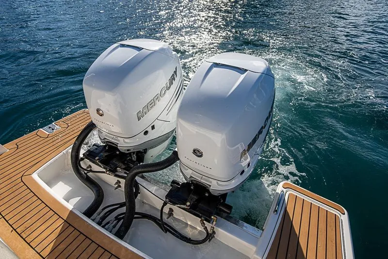 Slide: The Image of 2023 Tiara Sport 34 LS boat with dual Mercury outboard engines on water. - 53