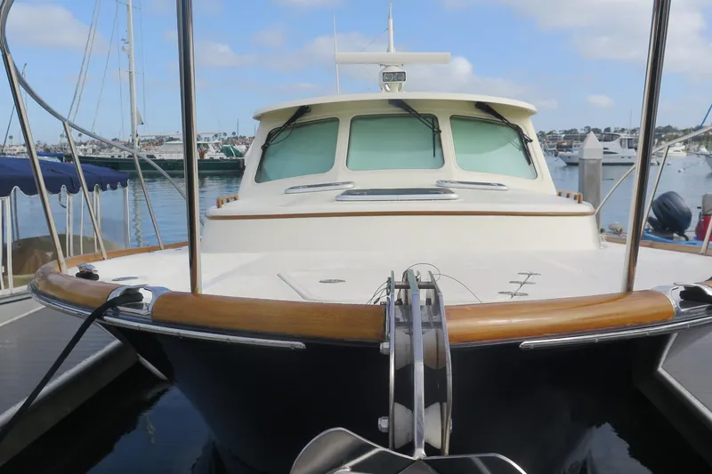 Slide: The Image of 2007 Hinckley Talaria 40 yacht docked in a marina, showcasing elegant design. - 10